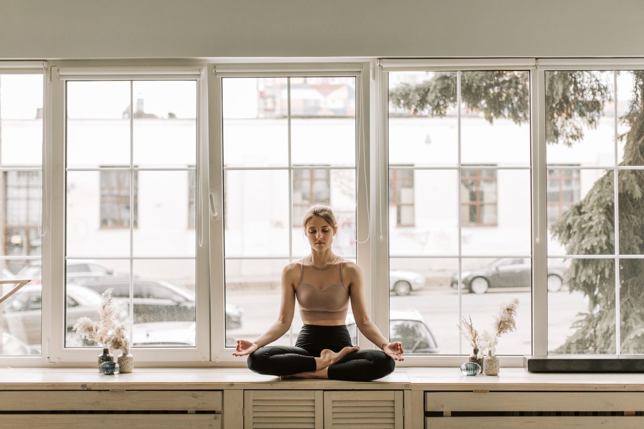 Person practicing 10 minutes of mindfulness meditation in a quiet room